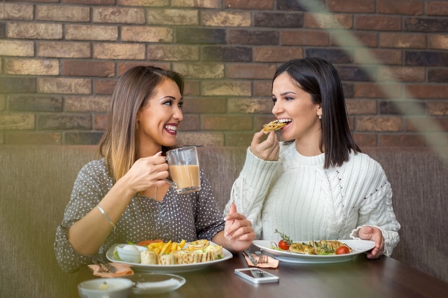 Two friends out at lunch talking about setting healthy boundaries and how this method has changed their life.